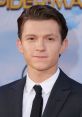 Tom Holland at a premiere event, showcasing his stylish attire and charismatic presence as Spider-Man.