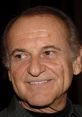 Joe Pesci smiles warmly, showcasing his iconic features and charm, a legendary actor known for memorable roles in film.