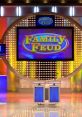 Family Feud game show set featuring vibrant colors and illuminated podiums, showcasing an iconic quiz competition setup.