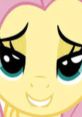 Fluttershy smiling playfully, embodying quirky and funny moments from "MLP Voice" series by MagicalMysticVA.