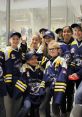 U17 PoCo Ravens girls' ice hockey team celebrating after a successful game, showcasing team spirit and camaraderie.