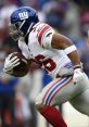 New York Giants player runs with football, showcasing skills crucial for fantasy football success during a game.