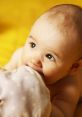 Adorable baby with big eyes chewing on a soft blanket, capturing the joy and curiosity of early childhood.