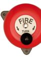 Red fire alarm bell with a "TURN" label, essential for emergency alert systems and safety procedures.