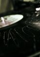 Close-up of a scratched vinyl record illustrating the iconic record scratch sound effect. Retro music vibes captured beautifully.