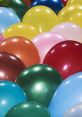 Colorful balloons in various shades, including green, pink, and blue, creating a festive and cheerful atmosphere.