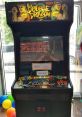 Double Dragon arcade machine with vibrant graphics, game controls, and free play sign, capturing a nostalgic gaming experience.