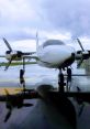 Single-engine aircraft on a rainy runway, showcasing its propellers and sleek design against cloudy skies.