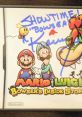 Autographed cover art featuring Mario and Luigi from "Bowser's Inside Story," celebrating character voices and nostalgia.