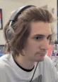 XQc focused during a live stream, showcasing his engaging gaming style and intense concentration as a top official streamer.