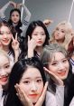 Loona group photo showcasing members posing playfully, displaying charming expressions and unique hairstyles.