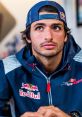 Carlos Sainz in Red Bull racing gear, looking intently, showcasing his passion for Formula 1 and motorsport excellence.