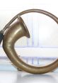 Vintage brass car horn featuring a curved design and polished finish, ideal for automotive restoration projects.