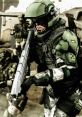 Halo Marine in tactical gear aiming a weapon in a combat environment, showcasing futuristic military design and action.