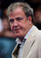 Jeremy Clarkson at a public event, showcasing his distinctive style and personality, known for automotive commentary.