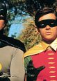 Batman and Robin in classic 1966 costumes, showcasing their iconic superhero partnership against a lush backdrop.