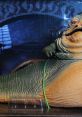 Jabba the Hutt figurine displayed in a showcase, featuring detailed textures and vibrant colors from the Star Wars universe.