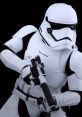 Action figure of a Stormtrooper holding a blaster, showcasing iconic white armor and detailed design against a black background.