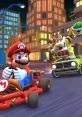 Mario races in his go-kart, pursued by Bowser, in a vibrant city setting from Mario Kart. High-speed fun and competition!