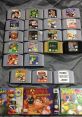 Collection of Nintendo 64 game cartridges including Super Smash Bros., featuring iconic titles from the era.