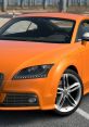 Stylish orange sports car showcasing sleek design and performance features, perfect for TTS dźwięki enthusiasts.