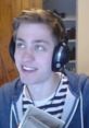 Sodapoppin laughing while gaming, wearing headphones and a striped shirt, with a casual background.