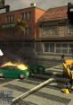 Transformers: The Game scene with burning cars and urban chaos, showcasing intense action effects on Wii.