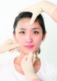 Facial treatment with gloved hands focusing on skin enhancement techniques for a rejuvenated look.