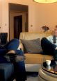 Andrew Tate discussing personal growth and success while seated in an elegant living room setting with another individual.