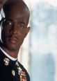 Major Payne in military uniform, showcasing a stern expression and medals, reflecting his leadership in the classic film.