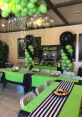 Festive game zone setup for Dylan's birthday party, featuring Lunatic Festa 4 theme, vibrant green and black decor, and snacks.