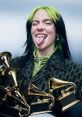 Billie Eilish playfully shows her fun side, surrounded by multiple Grammy Awards, showcasing her musical accomplishments.