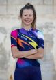 Ella Harris smiles confidently in a colorful Canyon cycling kit, showcasing her passion for women's cycling and sports.