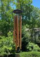 Windchimes The soft tinkling of Wooden Wind Chimes fills the air, a gentle melody that dances with the breeze. Each chime is