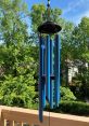 Wind-Chimes The melodic tones of wind chimes gently drift through the air, creating a soothing ambient backdrop. The of