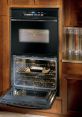 Oven The familiar of a microwave oven can be heard in the kitchen, emitting a soft "ping" as the cooking cycle comes to