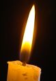 Candle The crackling of a wood wick candle fills the room with a comforting warmth, the flames flickering and dancing in the