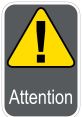 Yellow triangular warning sign with an exclamation mark and the word "Attention" on a gray background, emphasizing caution.