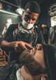 Barber The unmistakable of scissors cutting through hair rings through the air of a bustling barber shop. The sharp