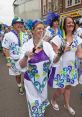 Samba-Band The vibrant of a Samba Band echo through the streets, drawing in spectators from all around. The rhythmic