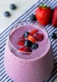 Smoothie You can hear the satisfying hum of a smoothie machine as it works its magic, blending a concoction of fresh