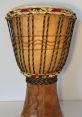 Djembe The vibrant and rhythmic of the Djembe echo through the air, creating a dynamic atmosphere that captivates