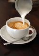 Cappuccino The sweet of a Starbucks barista saying "Two Cappuccinos" fills the air, accompanied by the smooth hum of the