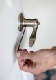 Doorhandle The first that fills the room is the loud and pronounced shaking of a door knob handle. The echoes through