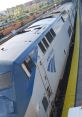 Amtrak train at the station, showcasing the engine design and vibrant platform with clear blue skies.