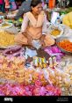 Street-Vendor In the bustling streets of a vibrant city, the call of the Street Vendor echoes through the air, drawing in