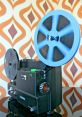 Cine-Projector The of a cine projector clicking on and whirring to life fills the room with anticipation. The mechanical