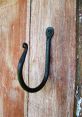 Hooks The of rusty hooks creaking and groaning as they are pulled from the dusty shelves in the old tool shed is a