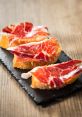 Iberico The of a sharp knife slicing through the tough exterior of a jamón ibérico is a symphony of precision and skill.