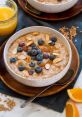 Delicious porridge topped with fresh blueberries, almonds, and a side of orange juice for a healthy breakfast.